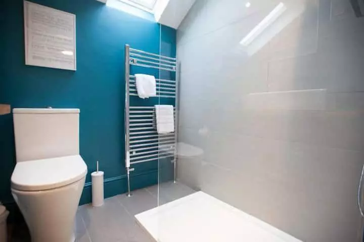 Bathroom wide view with shower enclosure